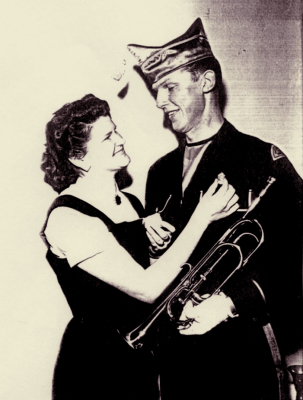 Lovebirds. Betty is pinning the Championship metal on Phil's uniform (about 1956)
Keywords: 1956