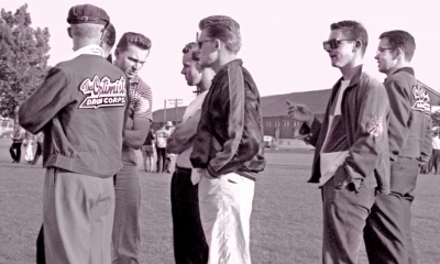 ?, Henry Beben (stripes), Dave Hanks (white t-shirt), Warren Mills (in Cavaliers jacket), John Carrie (black and white top), ? watching Del rehearse (Toronto Waterfront, 1960)
Photo by Don Daber
Keywords: 1960