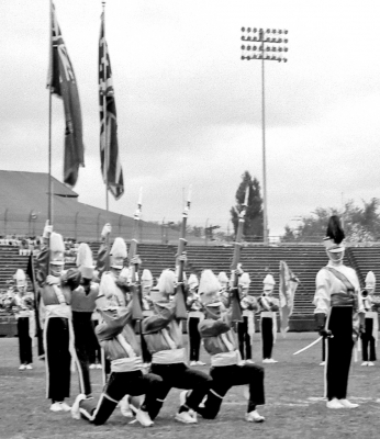 Toronto Optimists National Party: Bill McNabb, Andy Henderson and Al Miller with bayonets on their rifles, Ivor Bramley, Guard Captain with John Thomas and Mike Powers on Nationals (Varsity Stadium, 1962)
Photo by Don Daber
Keywords: 1962