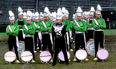 Toronto Optimists on retreat at Metro Toronto Championships (Varsity Stadium, 1962)
Centre: Jim McConkey, Drum Major
Front Row: Ron Kaiser, Ronn Prokop, Vic Kruklis, Orest Burak, Mark Wicken, Colin Hedworth
Next Row: Frank Rood, Bass (left) &  Dave Johns, Bass (right)

Photo submitted by John "Scotty" MacDonald
Keywords: 1962