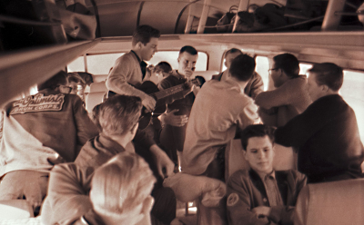 Ronn Prokop leading a sing-along on the bus from Hull (1963)
Photo by Don Daber

Looks like Bill Hannah in front, Ron Prokop with the guitar and Frans Rood covering his mouth.
Keywords: 1963