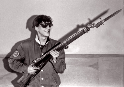 John Diamond with his rifle and one of the bayonets our rifles used in their duck and spin (not sure about the wig and blackened tooth) (Indoor, 1964)
Photo by Don Daber
Keywords: 1964