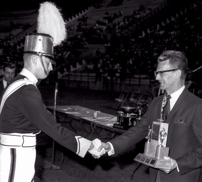 Ted Key, Ambassadors' Drum Major, receives trophy (Nationals, Montreal, 1966)
Photo by Don Daber
Keywords: 1966