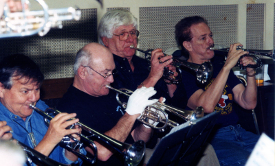 Alumni corps rehearsing (Jan 2003)
L-R: Terry Sweeney, Willie Miller, Frank Rivier, Al Morrison

Submitted by Vern Johansson
Keywords: 2003
