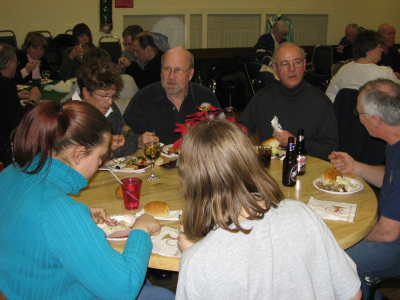 Pat & Barry Bell, Jack Roberts & part of Brian Collingdon (Christmas Party, 2005)
Photo by Phil Hennings
Keywords: 2005