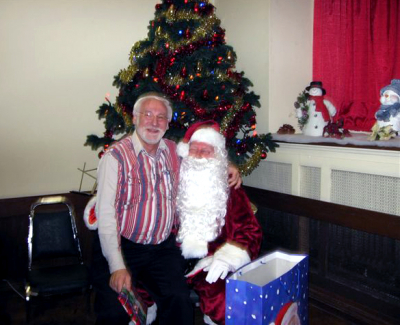 Dave Kirton with Santa (Christmas party, 2006)
Dave Kirton on Santa's knee

Photo submitted by Phil Hennings
Keywords: 2006