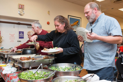 Jane, John, Kim & Keith filling up their plates (Christmas Party, 2013)
Photo by David Johns
Keywords: 2013