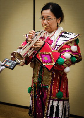 Kimiko tuning her horn, Optimists Alumni (Soundsport, Indianapolis, 2016)
Photo by David Johns
Keywords: 2016