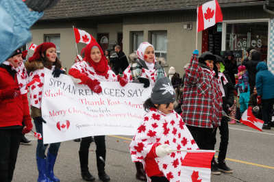 Syrian refugees say "Thank You" (Guelph Santa Claus parade, 2016)
Photo by Eric McConachie
Keywords: 2016