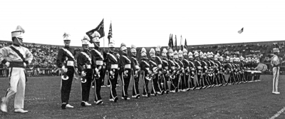 Doug McPhail, Assistant Drum Major for the Toronto Optimists (1961)
that is Doug McPhail as assistant drum major on the far left, Al Morrison is drum major, far right. This was also the drum line configuration in 1961. The 1960 drum line had the bass drums before the side drums, here they are after. This appears to be in the US somewhere

Photo by Don Daber
Keywords: 1961