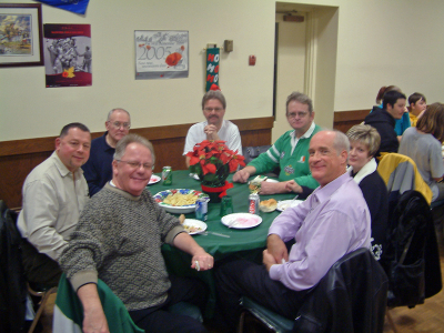 L-R: George Wright, Joe Lasko, Warren Mills, Ed Wilson, Pat, ?, Mike Lang (Christmas Party, 2005)
Photo by Frank Rood
Keywords: 2005