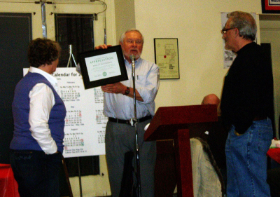 Henry Beben, Ron and Pat Cottrell, January Party (2008)
Henry is making a presentation to Ron and Pat Cottrell recognizing their support over the last few years with the sale of Chocolates.

Photo by Jan Burgess
Keywords: 2008