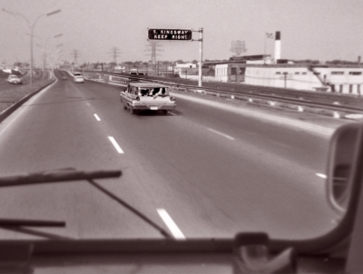 View from the bus - Looking at one of our station wagons with feet out the back window (1960)
Photo by Don Daber
Keywords: 1960