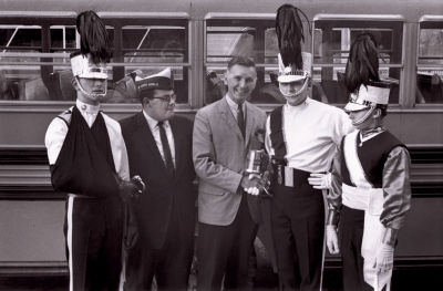 Gene Chepswick, Harvey Berish of Drum Corps World, Ed Rooney of Drum Corps News with Optimist beer mug, Andy Henderson and Vern Johansson (Nationals, 1964)
Photo by Don Daber
Keywords: 1964