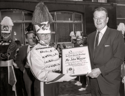 Jim McConkey presents John Wayne with an honorary membership in the Toronto Optimists (Hatari Parade, Toronto, June 25, 1962)
Photo by Don Daber
Keywords: 1962