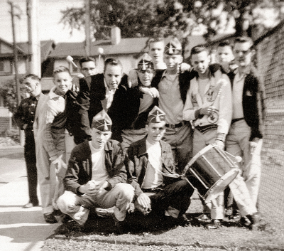Members of Opti-Corps
Submitted by Phil Hennings

Back Row L-R: man in black jacket ?, kid in jacket ?, with glasses ?, Brian Williams, Ed Nani, behind Bob Brown, Jim Patten, Harry Clark, behind ?, next Charley Sokoll

Front Row: Henry Beben, Paul Stephens
