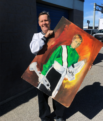 Ray Skyvington with a painting that Don Daber had painted of him "back in the day" (2019)
Photo by Vern Reid
Keywords: 2019